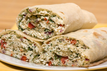 Pita bread wrapped with cottage cheese and vegetables