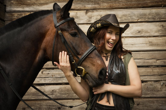 Cowgirl and brown horse