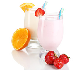 Delicious milk shakes with orange and strawberries isolated