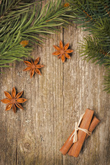 Christmas frame (fir branches, stars, star anise and cinnamon)