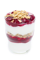 closeup of layered dessert with yogurt, granola, cherry isolated