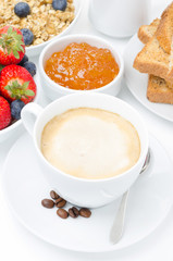 cup of cappuccino and breakfast, close-up selective focus
