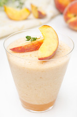 peach souffle in transparent glass, close-up
