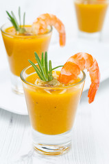 pumpkin soup with shrimp, Parmesan and rosemary close-up