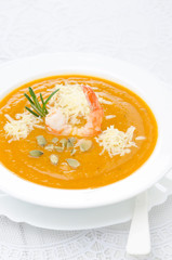 pumpkin soup with shrimp, Parmesan and rosemary vertical