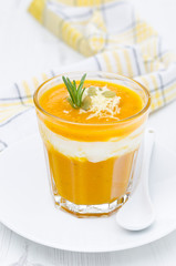 pumpkin soup with shrimp, yogurt and rosemary in a glass