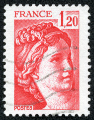 stamp shows The Sabine Women (detail) by Jacques-Louis David