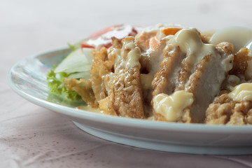 Chicken Salad topped with cream