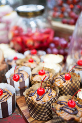 Fresh cherry-topped cupcakes and other snacks