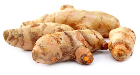 Raw Turmeric over white background