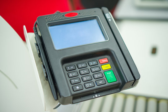 Card payment terminal at cash desk in supermarket