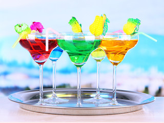 Different cocktails on bright background