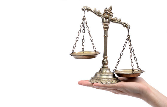 Holding Decorative Scales of Justice