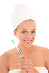 attractive woman with toothbrush and towel isolated over white b