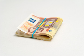 50 euro bills with rubber band isolated on a white background