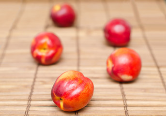 Nectarines on wood
