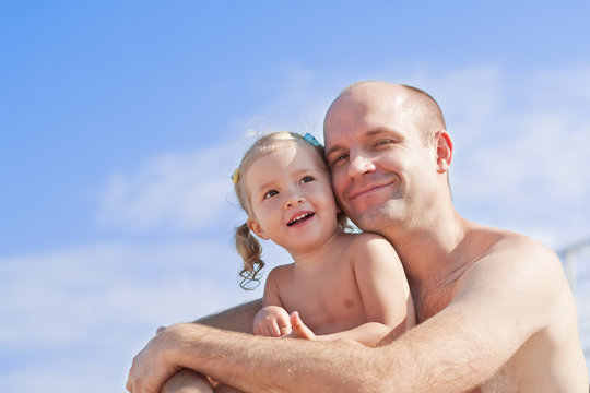 Smiling little girl with her father
