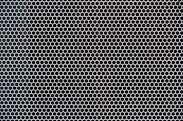 Background of gray metal with holes