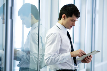young  business man holding a digital tablet