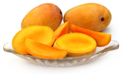 Fresh sliced Mangoes with whole ones