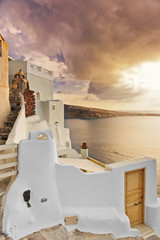 Typical villa overlooking the caldera at dusk in Oia