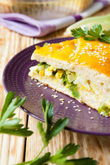 large piece of the pie with spring onions and eggs