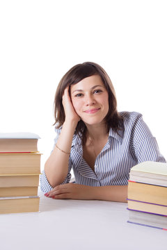 Student girl sitting with pile of books