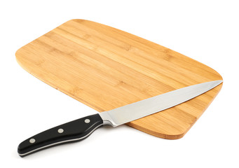 Knife over wooden cutting board