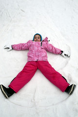 Fototapeta na wymiar girl play in snow