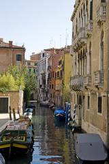 Fototapeta na wymiar Canal with boats in Venice