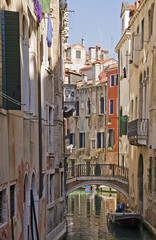 Fototapeta na wymiar Canal with bridge in Venice