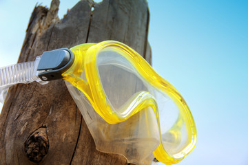 scuba diving mask on old timber