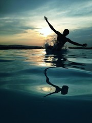 man jumping in water