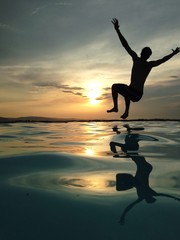 man jumping in water