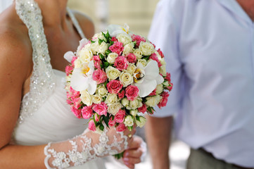 Wedding bouquet of flowers held by a bride