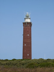 lighthouse with a blue sky as background