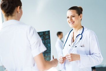 Fototapeta premium Doctor talking with a colleague