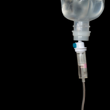 Infusion bottle with IV solution to help patient