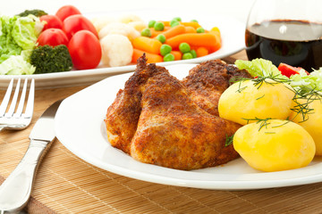 Roasted chicken wings with young potatoes