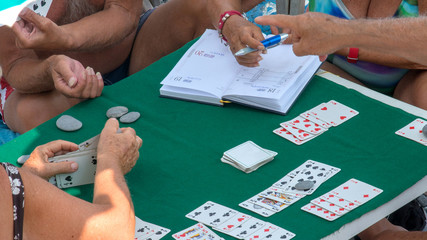 playing cards on the beach