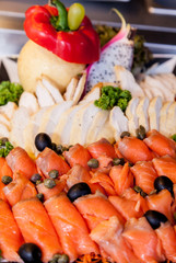 Smoked salmon rolls with cream cheese buffet.