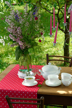 An inviting table is set beautifully and colorfully