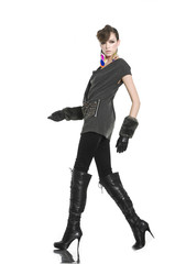 young casual man full body with gloves walking in studio