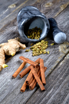 Still-life of spice and mortar on a wooden table