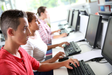 Group of young people in computing class