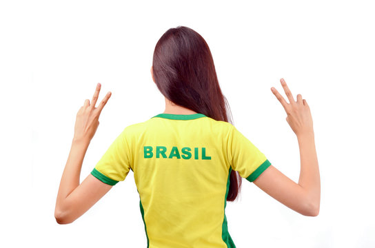 Girl with Brasil on the back of her shirt signing victory.
