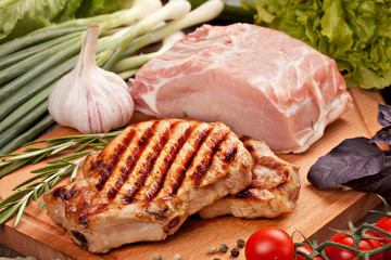 Raw and grilled meat  with vegetables