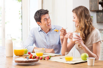 Obraz na płótnie Canvas Young Couple Having Breakfast
