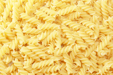 background with close up of spiral fusilli pasta