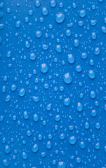 Water droplets on a blue background.